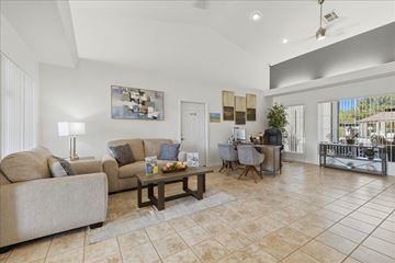 Prescott Valley apartment for rent - A living room with a couch, a coffee table, and a painting on the wall.