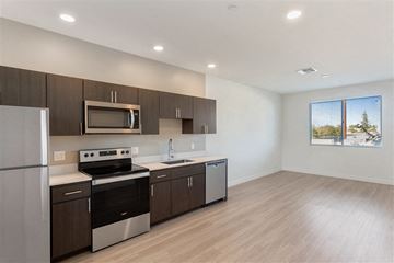Scottsdale apartment for rent - A modern kitchen with wooden cabinets and stainless steel appliances.