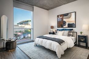 Phoenix apartment for rent - a bedroom with a bed and a large window