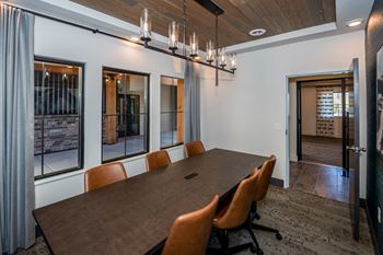 A conference room with a long table and chairs