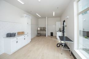 Prescott Valley apartment for rent - A kitchen with white cabinets and a black table  at The Crossings  at Windsong, Prescott Valley, 86314
