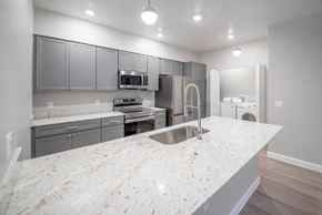 Cottonwood apartment for rent - a view of a kitchen with white tiled flooring at Inspiration Apartments, Cottonwood, AZ, 86326