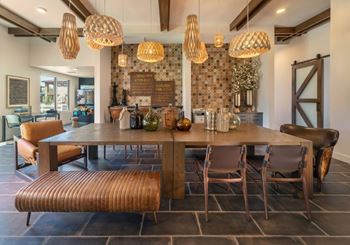Social clubroom with lounge seating, tvs, tabletop games & outdoor patio