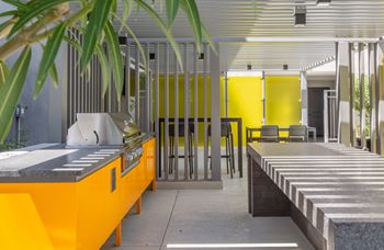 Outdoor entertainment area with lounge areas, outdoor dining & grills