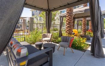 Outdoor entertainment area with lounge areas, outdoor dining & grills