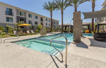 Stunning pool & spa with poolside cabanas & seating areas with firepits