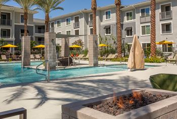 Stunning pool & spa with poolside cabanas & seating areas with firepits