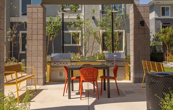 Outdoor entertainment area with lounge areas, outdoor dining & grills
