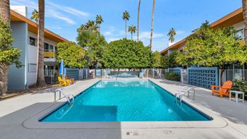 A rectangular pool with a diving board in the middle.