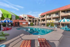 Phoenix apartment for rent - A pool area with a red and white striped pool mat. at Urban WalkApartments on 6th Avenue, Phoenix, Arizona