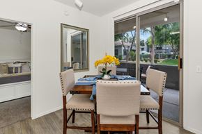 Phoenix apartment for rent - Dining area with patio access and natural light at Ventura Vista Apartments, Phoenix, AZ 85024
