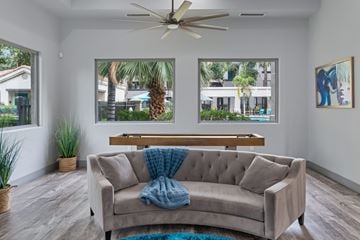 Phoenix apartment for rent - A living room with a couch and a ceiling fan.
