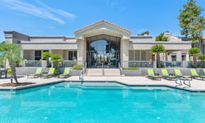 Chandler apartment for rent - A large house with a pool in front.
