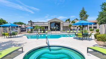 Poolside loungers & patio tables with umbrellas