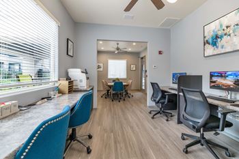 Business center with workstations and conference room