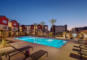 Laveen apartment for rent - a swimming pool at night with apartments in the background at Weylyn Luxury Apartments, Arizona, 85339