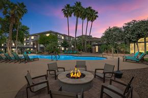 Chandler apartment for rent - A fire pit sits in the middle of a patio at Montage at Pecos Ranch Apartments, Arizona, 85286