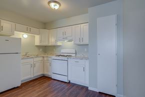 Milwaukee apartment for rent - Kitchen With White Cabinetry And Appliances at Johnson Legacy Apartments, Milwaukee, WI, 53223