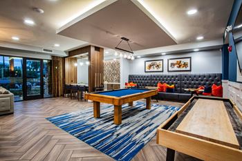 The reserve on cave creek apartments game room complete with billiards, shuffleboard and wall scrabble