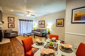 Dallas apartment for rent - A dining room with a table set for a meal.