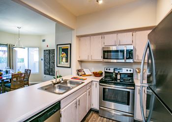 Vintage at the lakes apartment homes full kitchen with pass-through serving bar