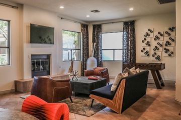 Phoenix apartment for rent - a living room with a fireplace and chairs and a table