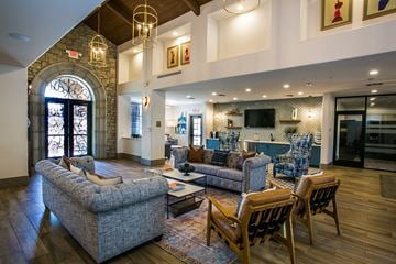 Avondale apartment for rent - a living room with couches and chairs and a kitchen