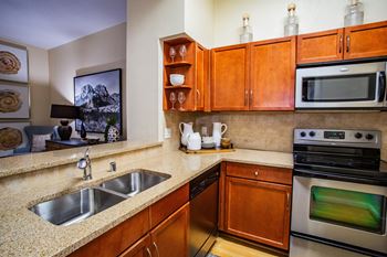 The reserve on cave creek apartments cherry or mable cabinetry in kitchen