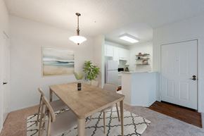 Ventura apartment for rent - Ventura, CA Apartments - Cypress Meadows - Dining Area with a Hanging Light Fixture, Wooden Table, and an Area Rug