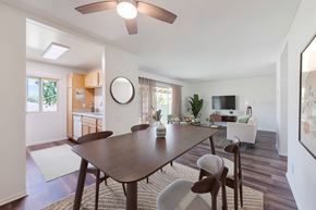 Goleta apartment for rent - A modern dining room with a wooden table and chairs.