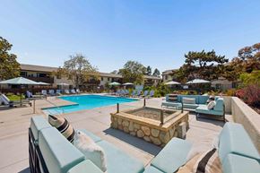 Goleta apartment for rent - A pool area with a hot tub and lounge chairs.