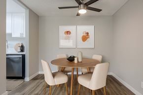 Santa Barbara apartment for rent - a dining room with a table and chairs and a ceiling fan
