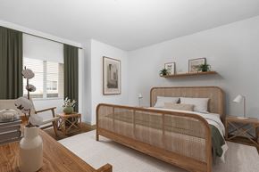 Goleta apartment for rent - Goleta, CA, Apartments Near Albertsons - Willow Springs Apartments - Bedroom With Woven Wood Bed Frame, Nightstands, Lamps, Armchair, and Window with Coverings.