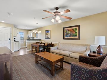 Clarkesville apartment for rent - A living room with a brown couch and a wooden coffee table.