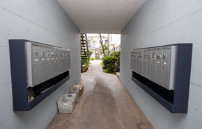 Los Angeles apartment for rent - A long hallway with a row of mailboxes on the wall.