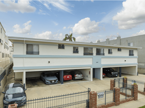 Los Angeles apartment for rent - A parking garage with cars parked in it.