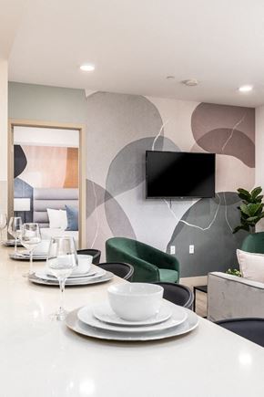 Los Angeles apartment for rent - Modern dining area with abstract wall mural at Lido - 1532 Brockton Ave Apartments, California