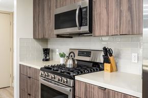 Los Angeles apartment for rent - Modern kitchen with gas range and subway tile backsplash at Lido - 1532 Brockton Ave Apartments, Los Angeles, CA
