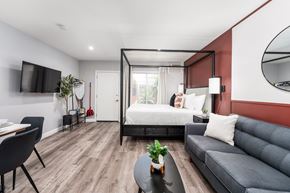 Los Angeles apartment for rent - a bedroom with a bed and a couch and a table