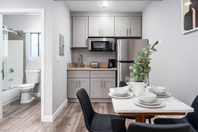 Los Angeles apartment for rent - a kitchen and dining room with a table and chairs