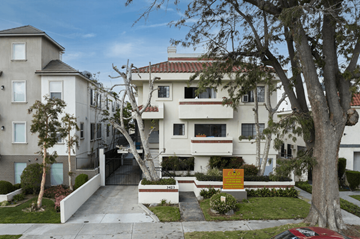 Los Angeles apartment for rent - an apartment building with a driveway and trees in front of it