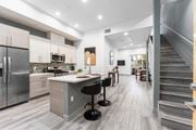 Culver City townhouse for rent - a kitchen with a counter top and a staircase at Lido Apartments - 4025 Grandview, California, 90066