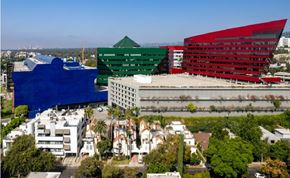West Hollywood apartment for rent - A cityscape with buildings in blue, green and red.