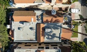 West Hollywood apartment for rent - A top-down view of a residential area with terracotta roofs.