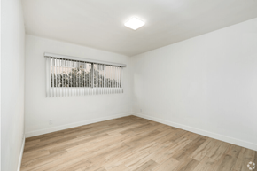 Los Angeles apartment for rent - a living room with white walls and wood floors and a window