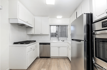 Los Angeles apartment for rent - a kitchen with white cabinets and stainless steel appliances