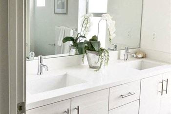 Renovated bathrooms with quartz counters