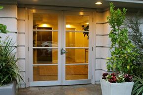 Los Angeles apartment for rent - A glass door is flanked by two planters.
