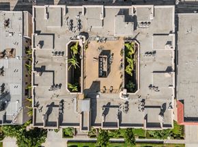 Los Angeles apartment for rent - A courtyard surrounded by buildings with a fountain in the middle.