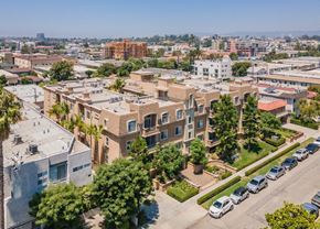 Los Angeles apartment for rent - A residential area with apartment buildings and parked cars.